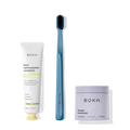 Fresh on the Go: nano-hydroxyapatite toothpaste, charcoal bristle brush, and mouthwash tablets on white.