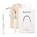 Boka stainless steel tongue cleaner with packaging and drawstring bag on a white background